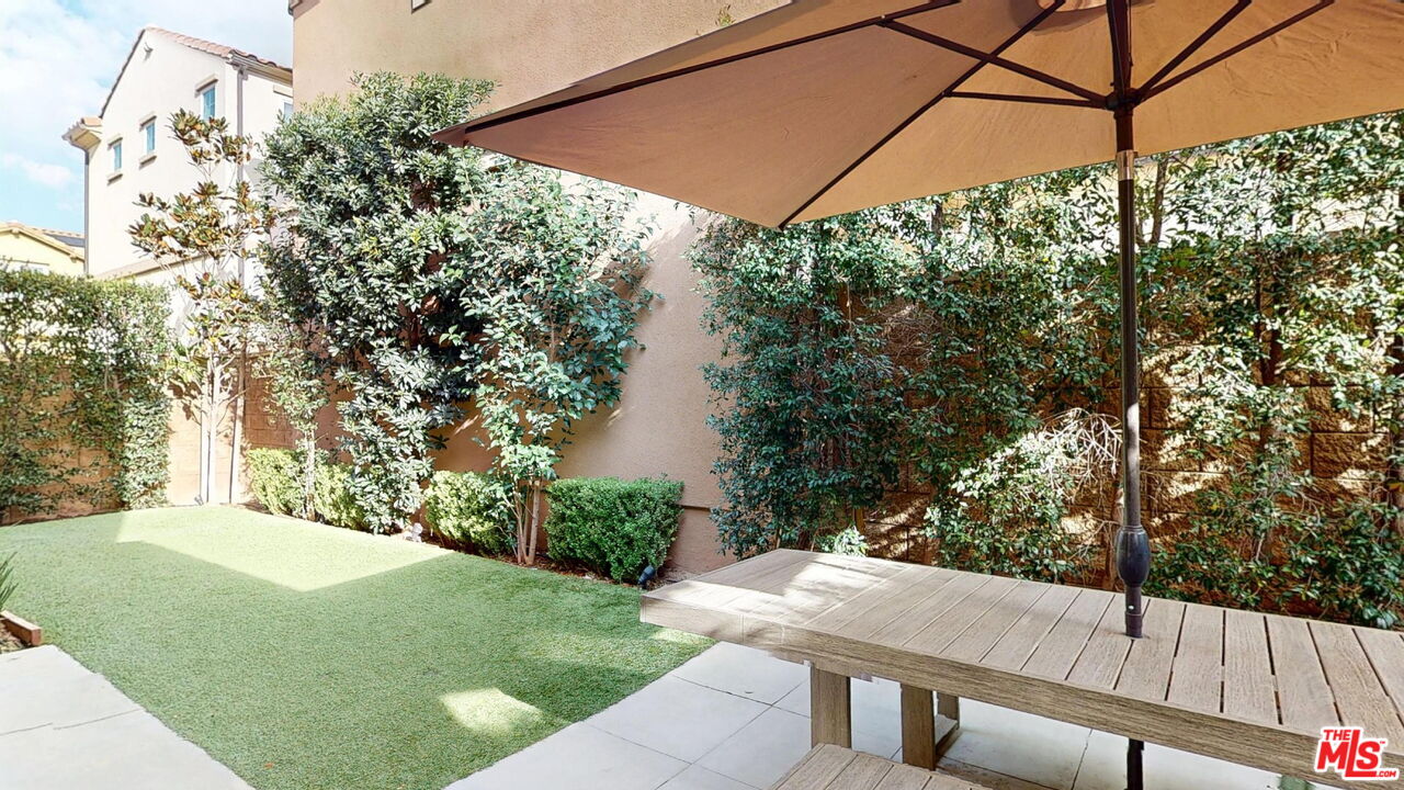 20607 West Chestnut Circle Porter Ranch, CA 91326 - Photo 14 of 52 a view of a yard with a tree