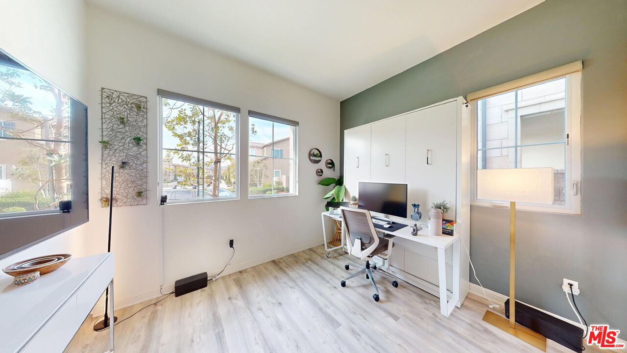 20607 West Chestnut Circle Porter Ranch, CA 91326 - Photo 15 of 52 a view of a workspace with wooden floor and a window