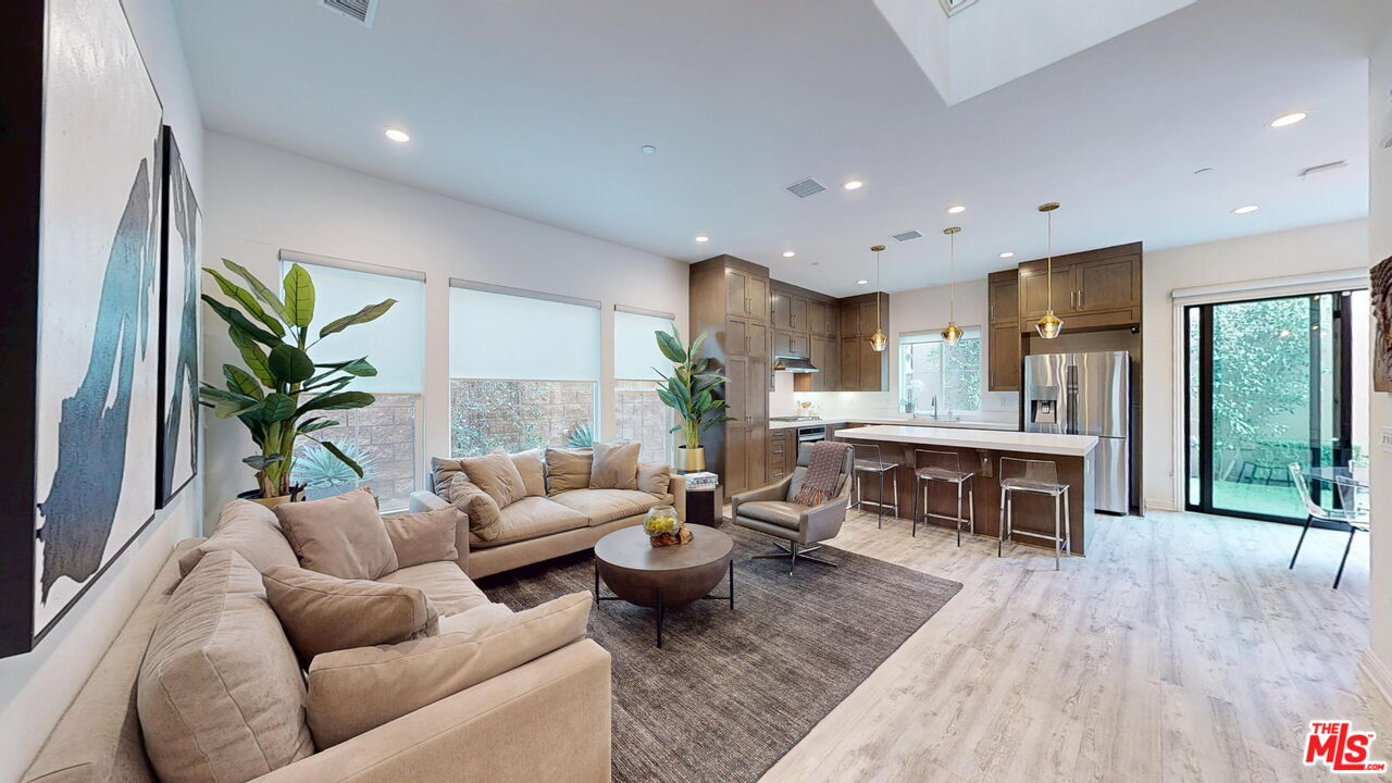 20607 West Chestnut Circle Porter Ranch, CA 91326 - Photo 2 of 52 a living room with furniture kitchen view and a large window