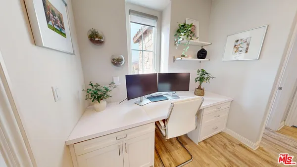 a workspace with furniture and window