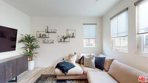 a view of a dining area with furniture window and wooden floor