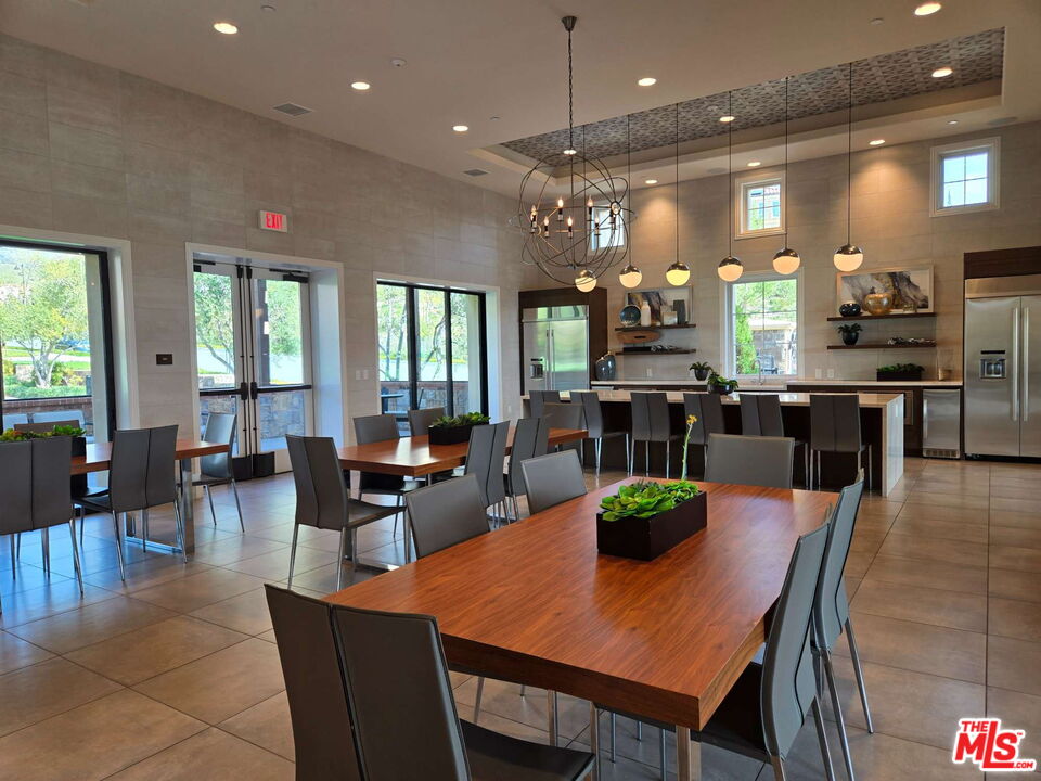 20607 West Chestnut Circle Porter Ranch, CA 91326 - Photo 30 of 52 a view of a dining area with furniture window and wooden floor