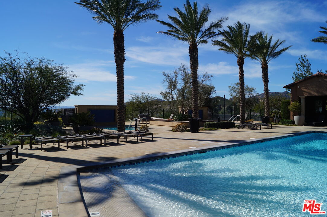 20607 West Chestnut Circle Porter Ranch, CA 91326 - Photo 37 of 52 a view of swimming pool with chairs and tables
