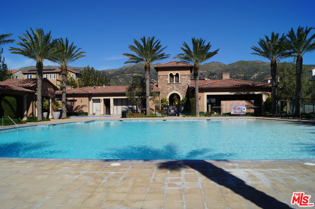 20607 West Chestnut Circle Porter Ranch, CA 91326 - Photo 41 of 52 a front view of a house with garden