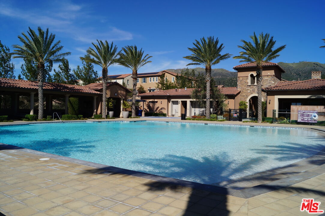 20607 West Chestnut Circle Porter Ranch, CA 91326 - Photo 43 of 52 a front view of house with yard and lake view