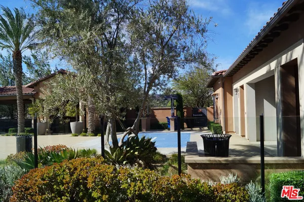 a view of a park with large trees