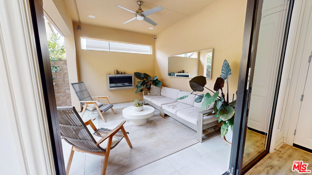 20607 West Chestnut Circle Porter Ranch, CA 91326 - Photo 10 of 52 a dining room with furniture and a floor to ceiling window