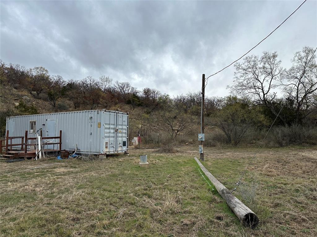 5730 Gobbler Hollow Road Brownwood, TX 76801 - Photo 7 of 37 a backyard of a house with lots of green space