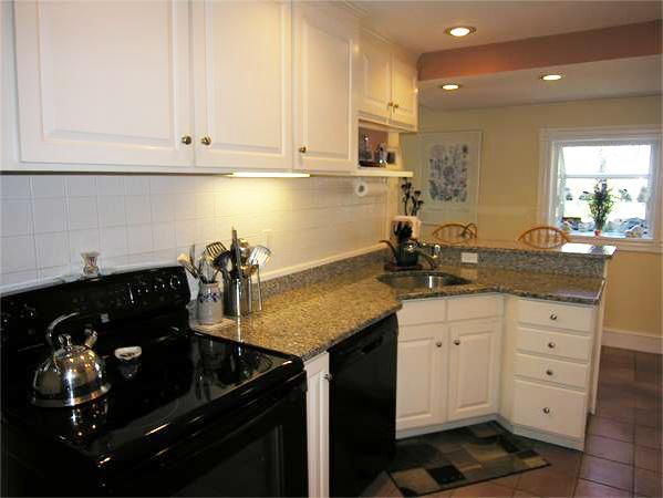 128 Hillcrest Road Needham, MA 02492 - Photo 14 of 28 a kitchen with a sink and cabinets