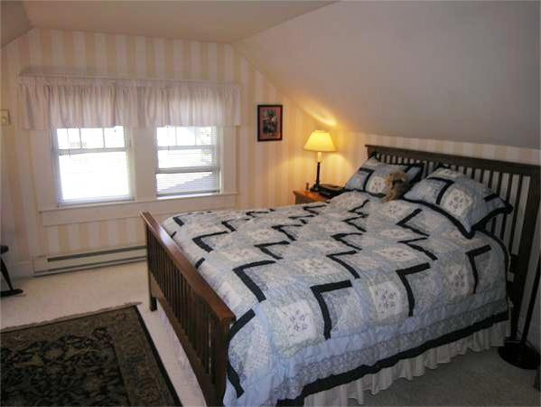 128 Hillcrest Road Needham, MA 02492 - Photo 18 of 28 a bedroom with a bed and window