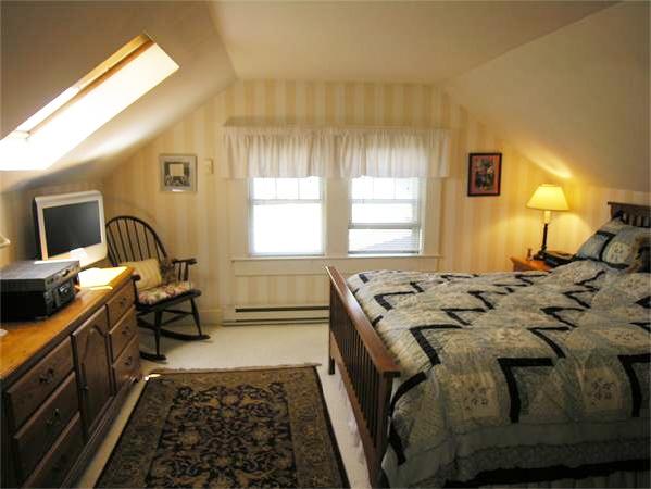 128 Hillcrest Road Needham, MA 02492 - Photo 20 of 28 a bed sitting in a bedroom next to a window