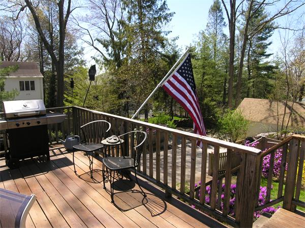 128 Hillcrest Road Needham, MA 02492 - Photo 24 of 28 a view of deck with chairs and wooden fence