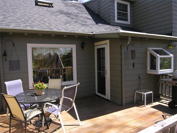 128 Hillcrest Road Needham, MA 02492 - Photo 26 of 28 a patio with table and chairs and potted plants