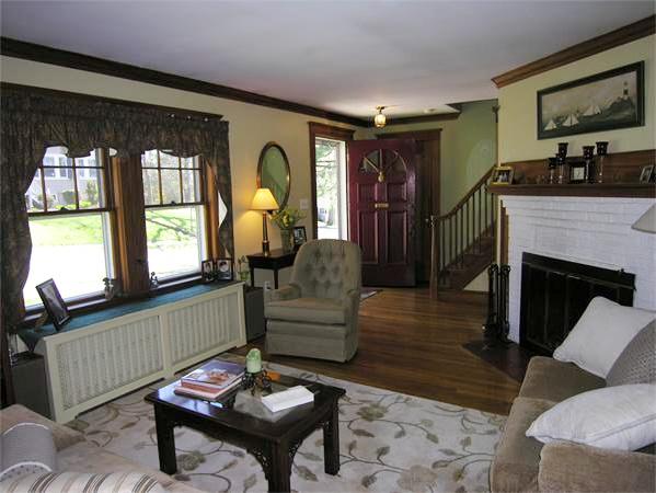 128 Hillcrest Road Needham, MA 02492 - Photo 5 of 28 a living room with furniture a fireplace and a large window