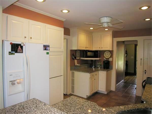128 Hillcrest Road Needham, MA 02492 - Photo 10 of 28 a kitchen with stainless steel appliances kitchen island granite countertop a refrigerator and a sink