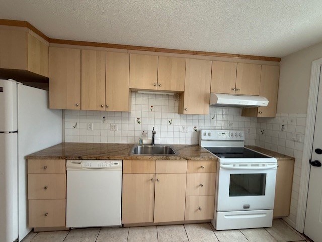 12 Cutter Street, Unit 1 Waltham, MA 02453 - Photo 4 of 9 a kitchen with cabinets appliances a sink and a counter top