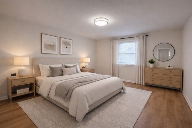 12 Cutter Street, Unit 1 Waltham, MA 02453 - Photo 5 of 9 a bedroom with a bed and a closet