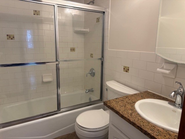 12 Cutter Street, Unit 1 Waltham, MA 02453 - Photo 7 of 9 a bathroom with a granite countertop sink toilet and shower