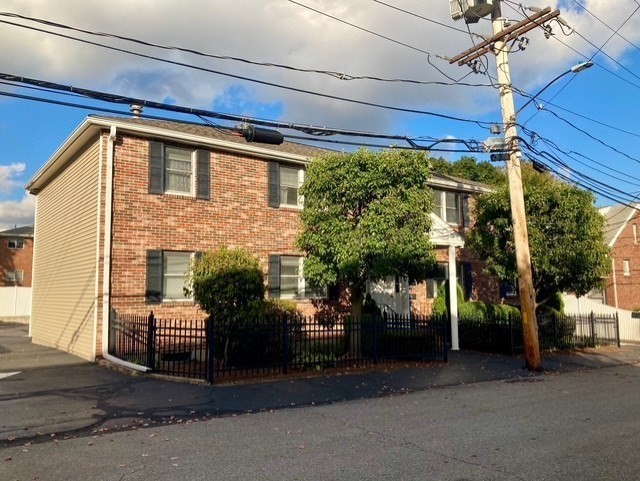 12 Cutter Street, Unit 1 Waltham, MA 02453 - Photo 9 of 9 a view of a car park in front of house