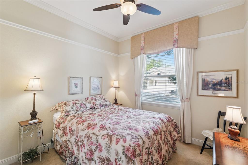 6552 Helmsley Circle Windermere, FL 34786 - Photo 30 of 53 a bedroom with a bed and a chandelier