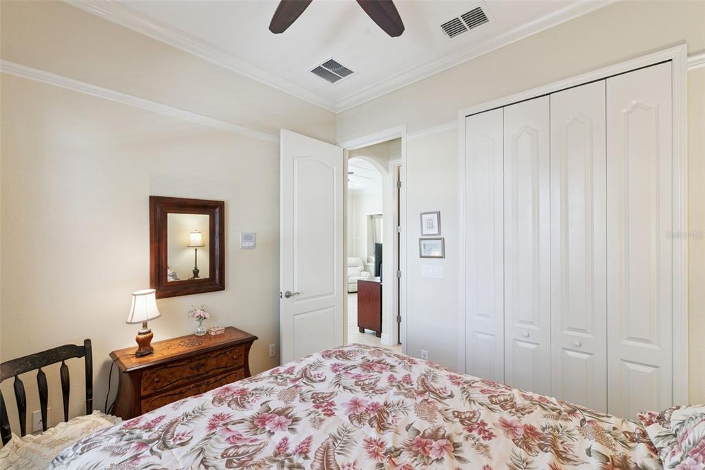 6552 Helmsley Circle Windermere, FL 34786 - Photo 31 of 53 a bedroom with a bed and a dresser