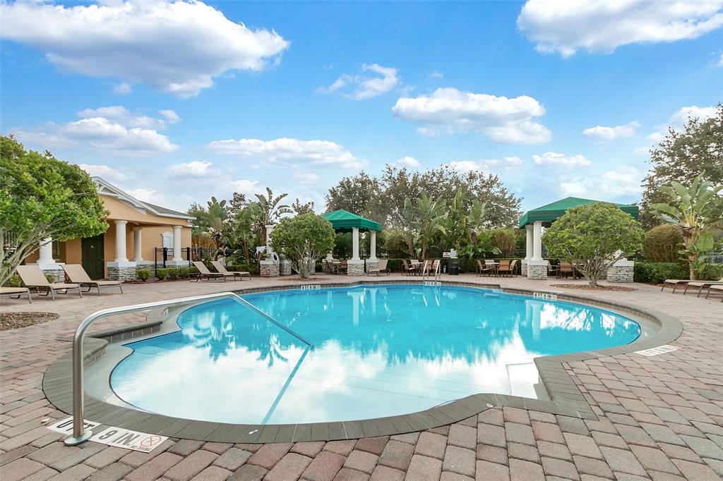 6552 Helmsley Circle Windermere, FL 34786 - Photo 40 of 53 a view of a swimming pool with a chairs