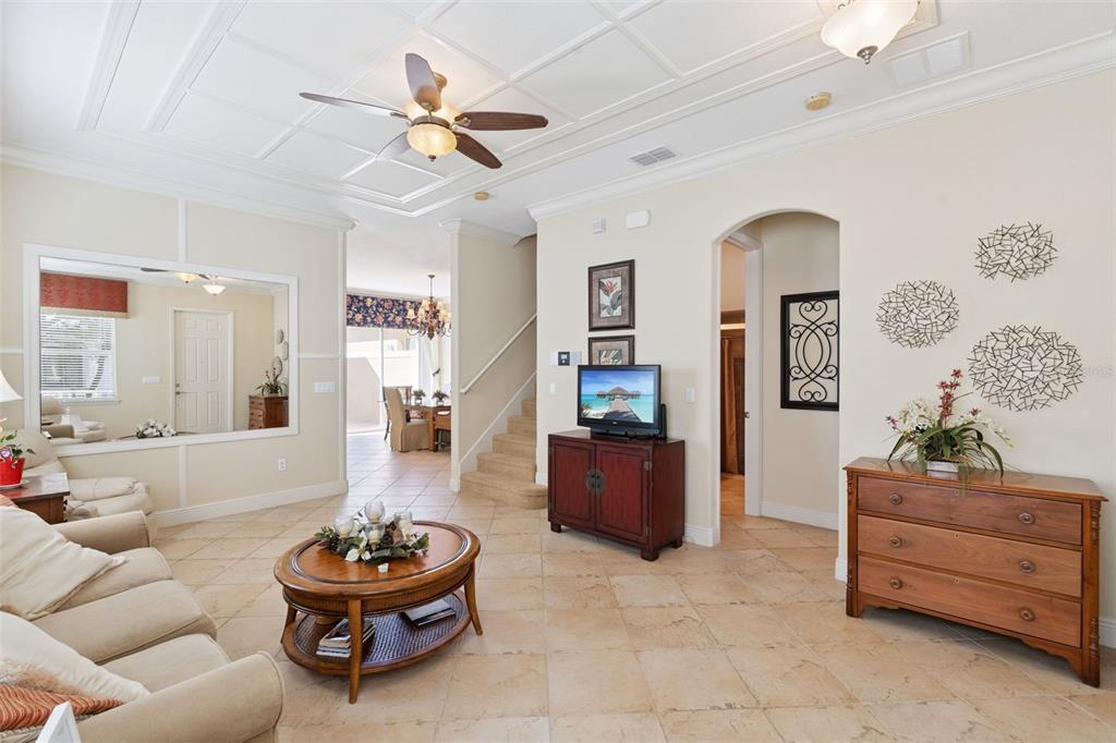 6552 Helmsley Circle Windermere, FL 34786 - Photo 4 of 53 a living room with furniture and a chandelier