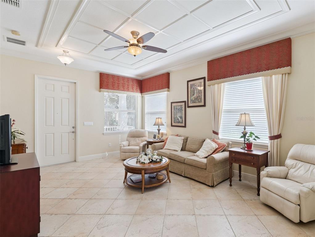 6552 Helmsley Circle Windermere, FL 34786 - Photo 5 of 53 a living room with furniture and a flat screen tv