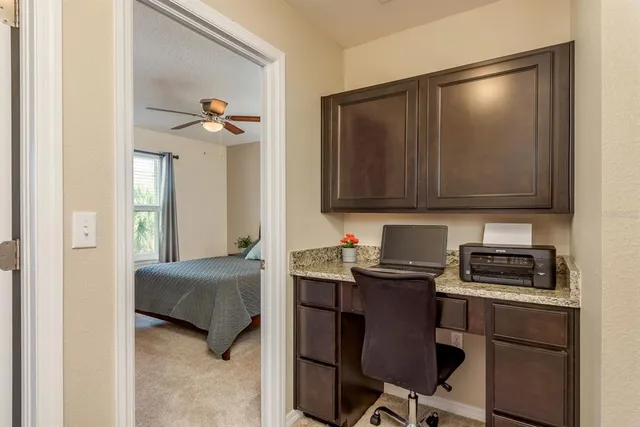 a bedroom with a bed and a television