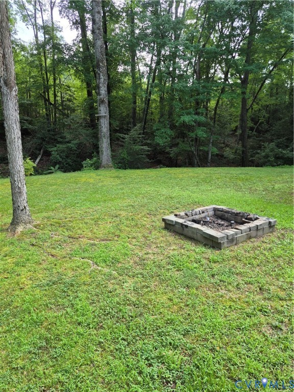 14221 Cooks Mill Road Lanexa, VA 23089 - Photo 6 of 15 Expansive lawn featuring a built-in stone fire pit