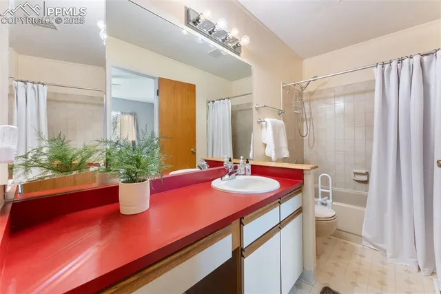 a bath room with a sink and a mirror