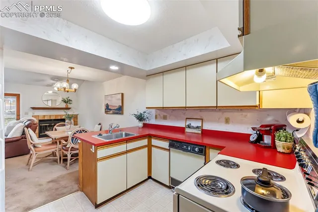 a kitchen with a stove and cabinets