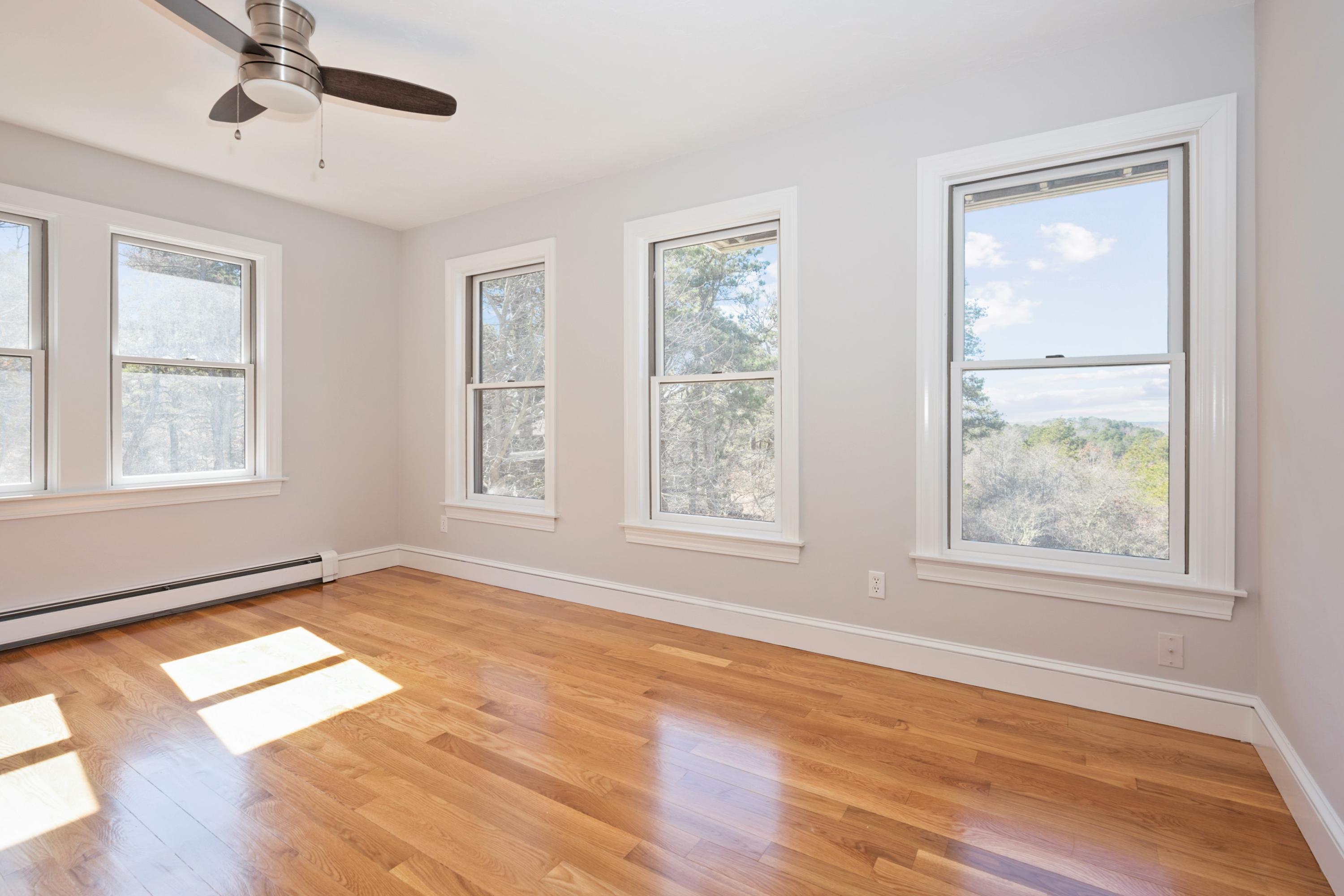 50 Major Doane Road Wellfleet, MA 02667 - Photo 25 of 91 a view of an empty room with wooden floor and a window