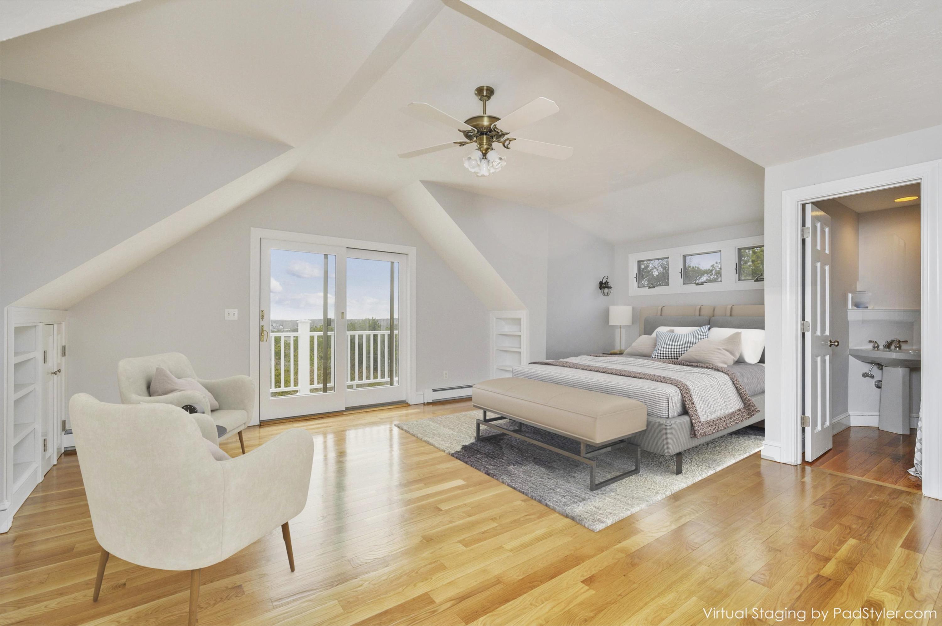 50 Major Doane Road Wellfleet, MA 02667 - Photo 29 of 91 a spacious bedroom with a bed a couch and large windows
