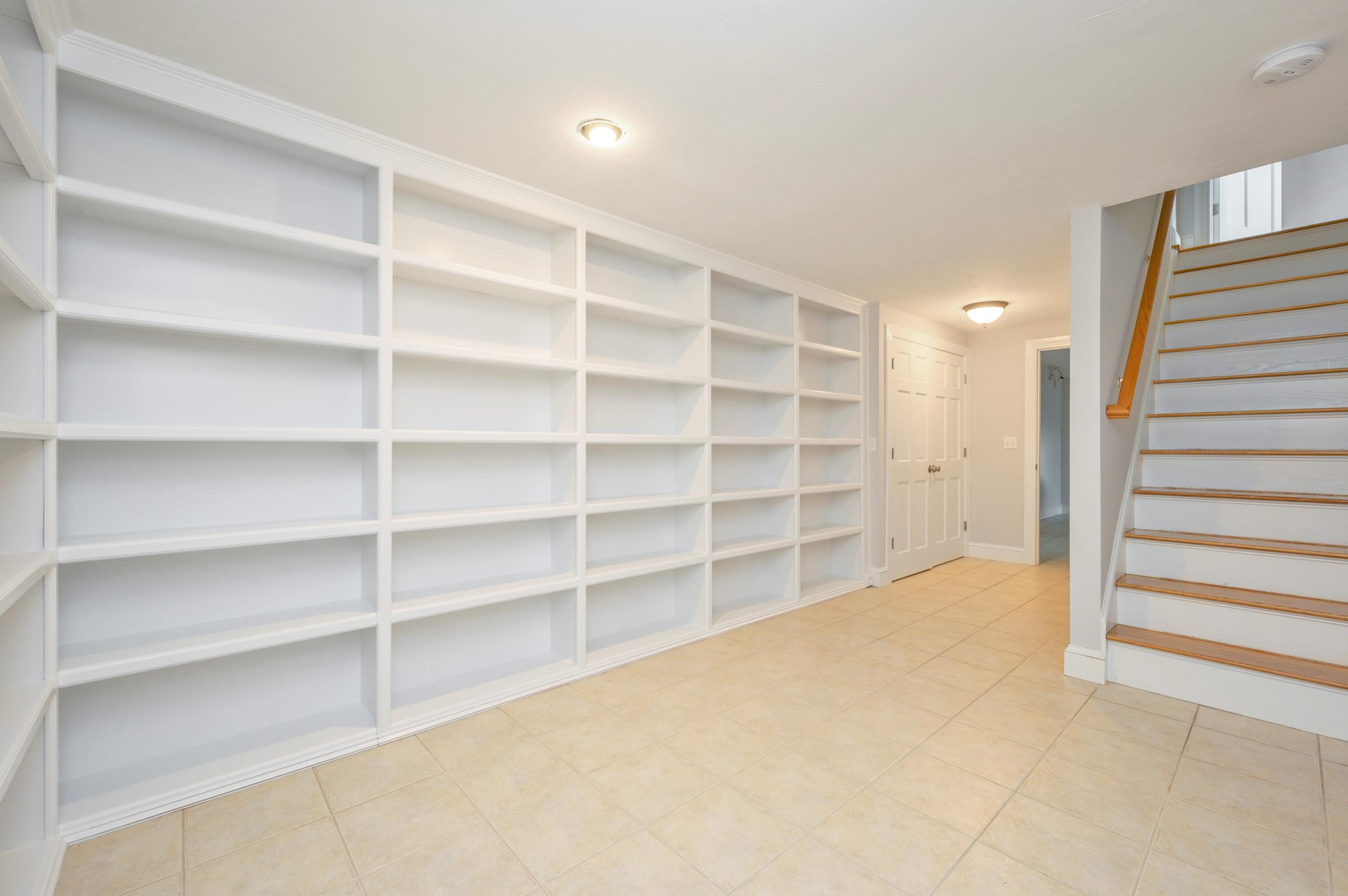 50 Major Doane Road Wellfleet, MA 02667 - Photo 48 of 91 a view of room with empty cabinets and empty racks