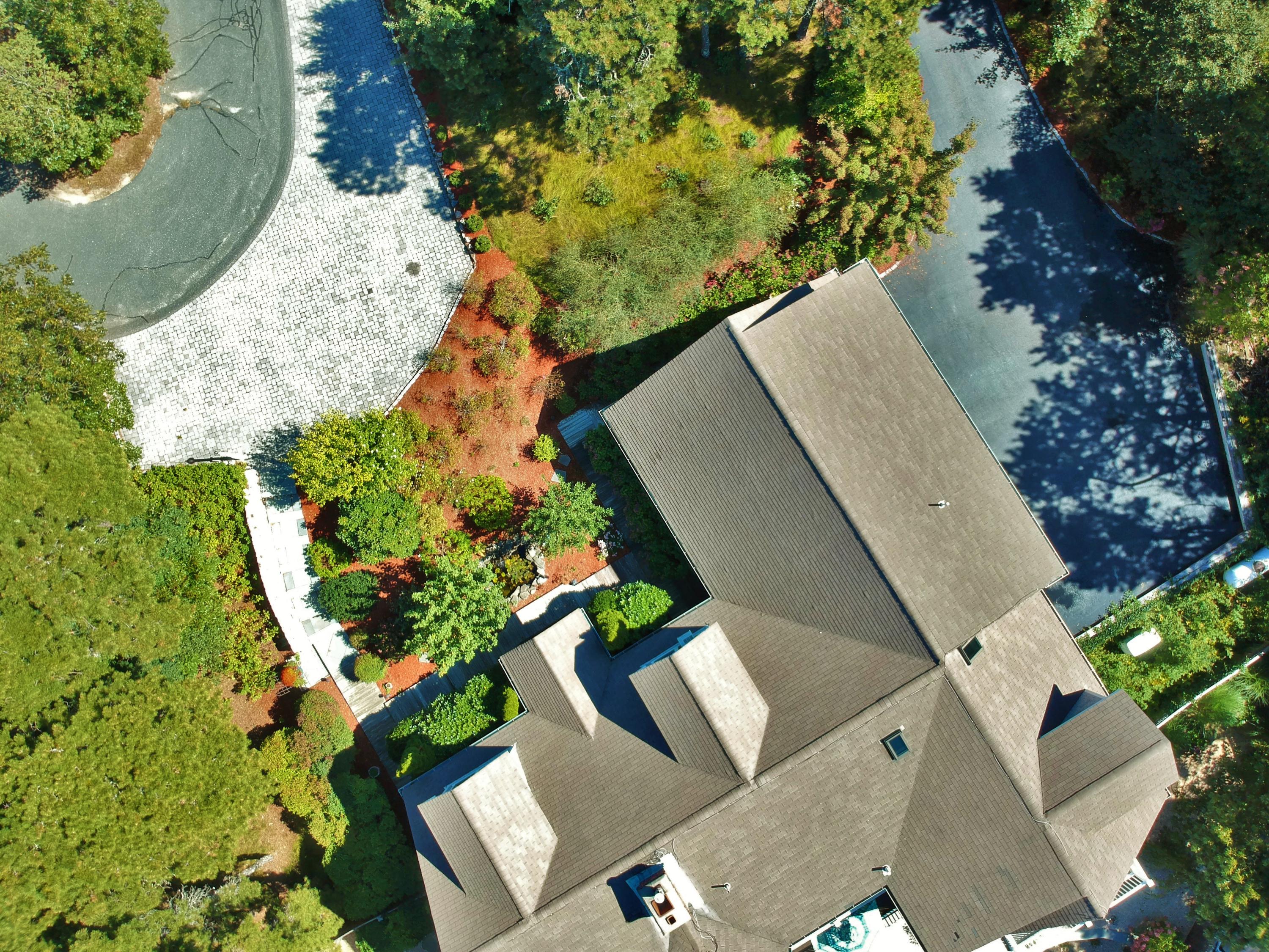 50 Major Doane Road Wellfleet, MA 02667 - Photo 59 of 91 an aerial view of a house with a yard and trees