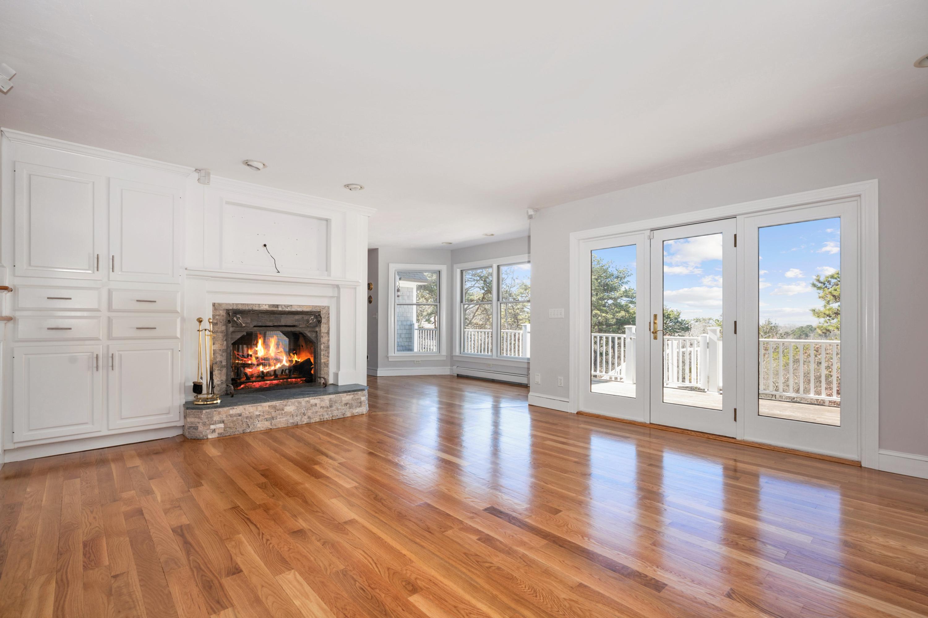 50 Major Doane Road Wellfleet, MA 02667 - Photo 10 of 91 a view of an empty room with wooden floor and a window