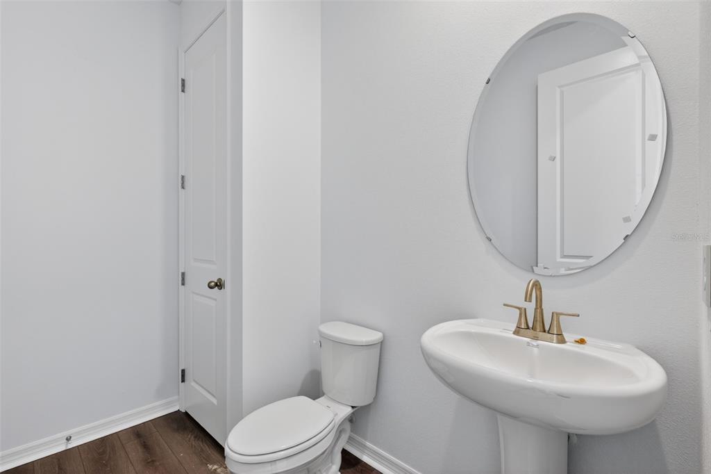 5777 Haystack Drive St. Cloud, FL 34771 - Photo 14 of 37 a bathroom with a sink toilet and a mirror