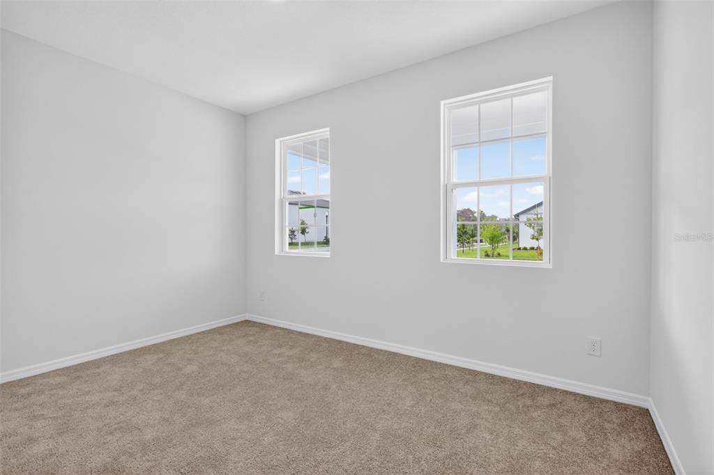 5777 Haystack Drive St. Cloud, FL 34771 - Photo 21 of 37 an empty room with windows