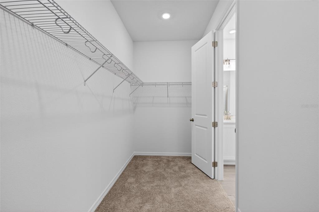 5777 Haystack Drive St. Cloud, FL 34771 - Photo 27 of 37 a view of a room with racks on the wall