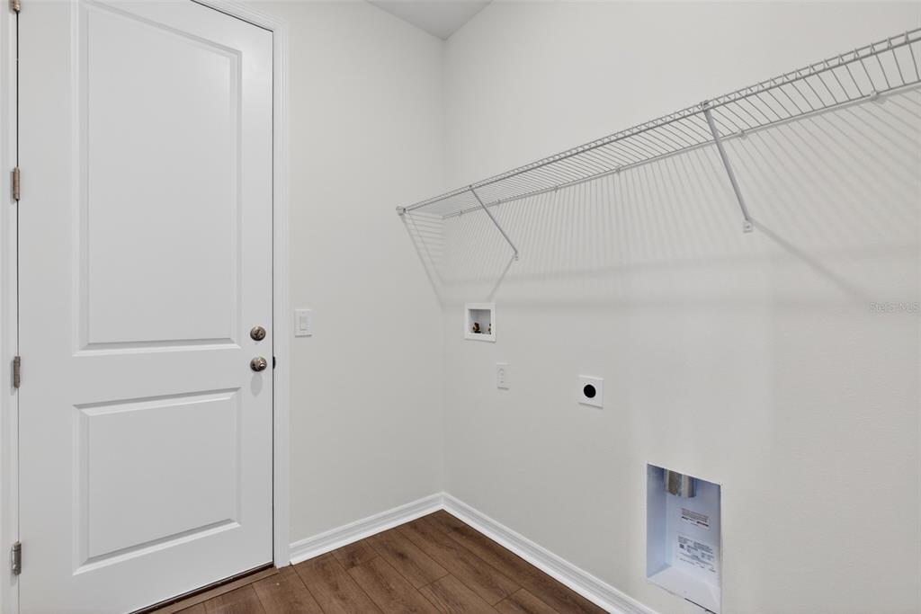 5777 Haystack Drive St. Cloud, FL 34771 - Photo 28 of 37 a view of small space with racks on the wall