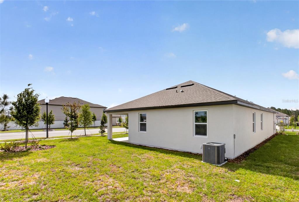 5777 Haystack Drive St. Cloud, FL 34771 - Photo 33 of 37 a view of a house with pool and a yard