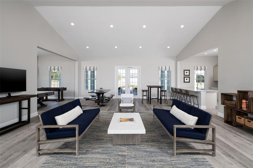 5777 Haystack Drive St. Cloud, FL 34771 - Photo 35 of 37 a living room with furniture a flat screen tv and a rug