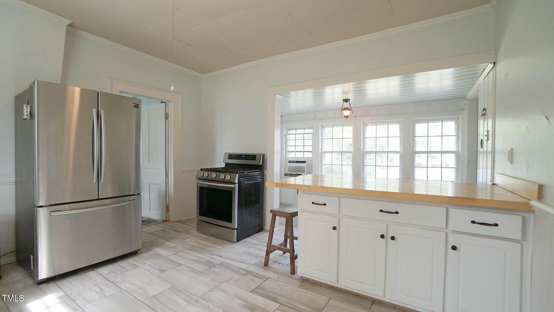 9358 Main Street Castalia, NC 27816 - Photo 41 of 92 a kitchen with stainless steel appliances granite countertop a refrigerator and a sink