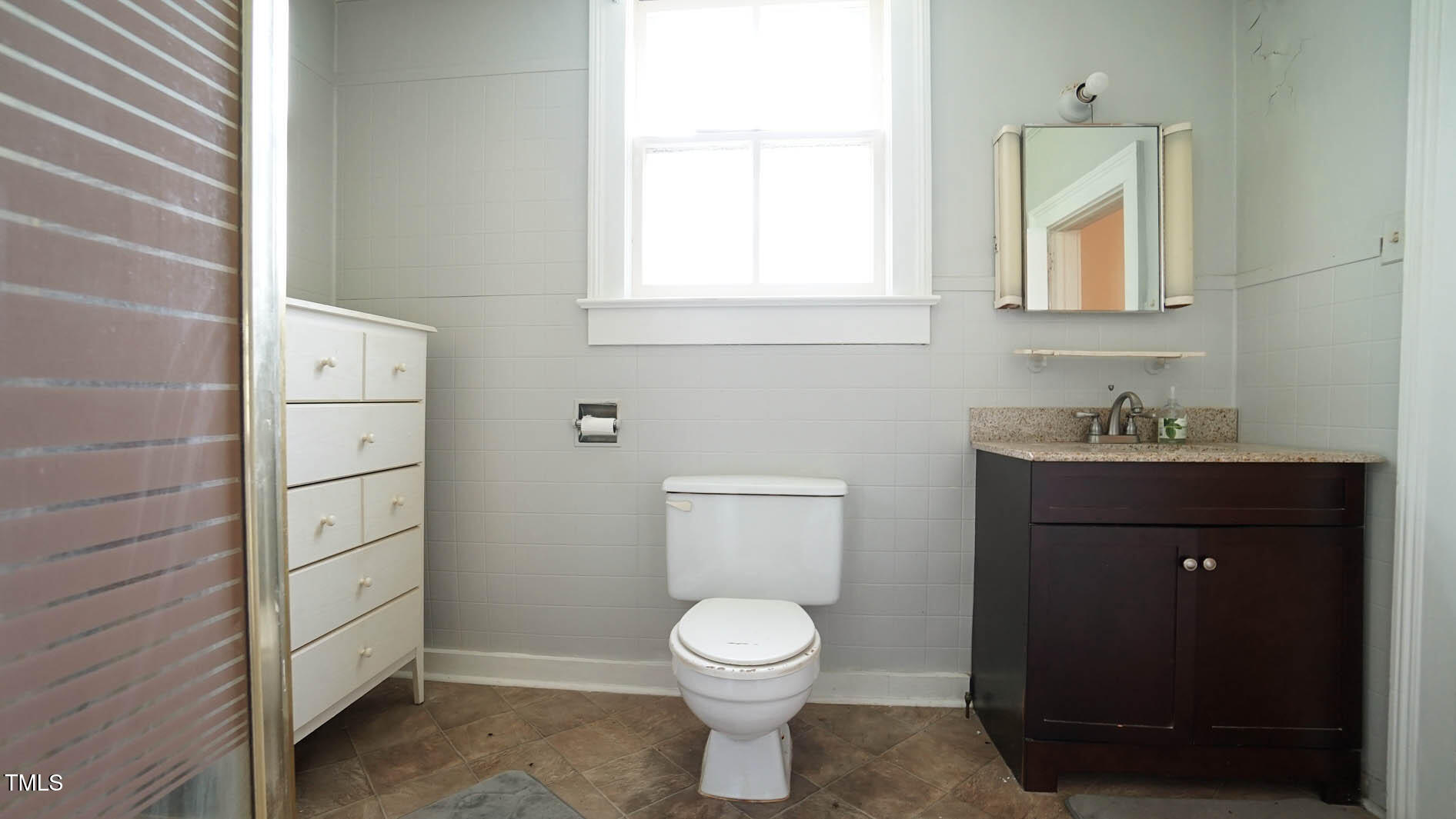 9358 Main Street Castalia, NC 27816 - Photo 53 of 92 a bathroom with a toilet a sink and mirror