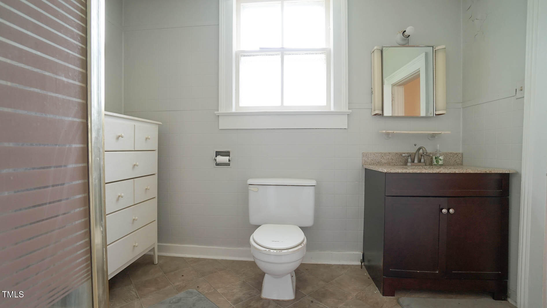 9358 Main Street Castalia, NC 27816 - Photo 54 of 92 a bathroom with a toilet a sink and mirror