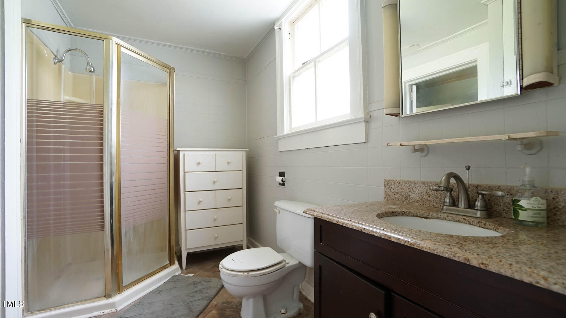9358 Main Street Castalia, NC 27816 - Photo 55 of 92 a bathroom with a sink a toilet and shower