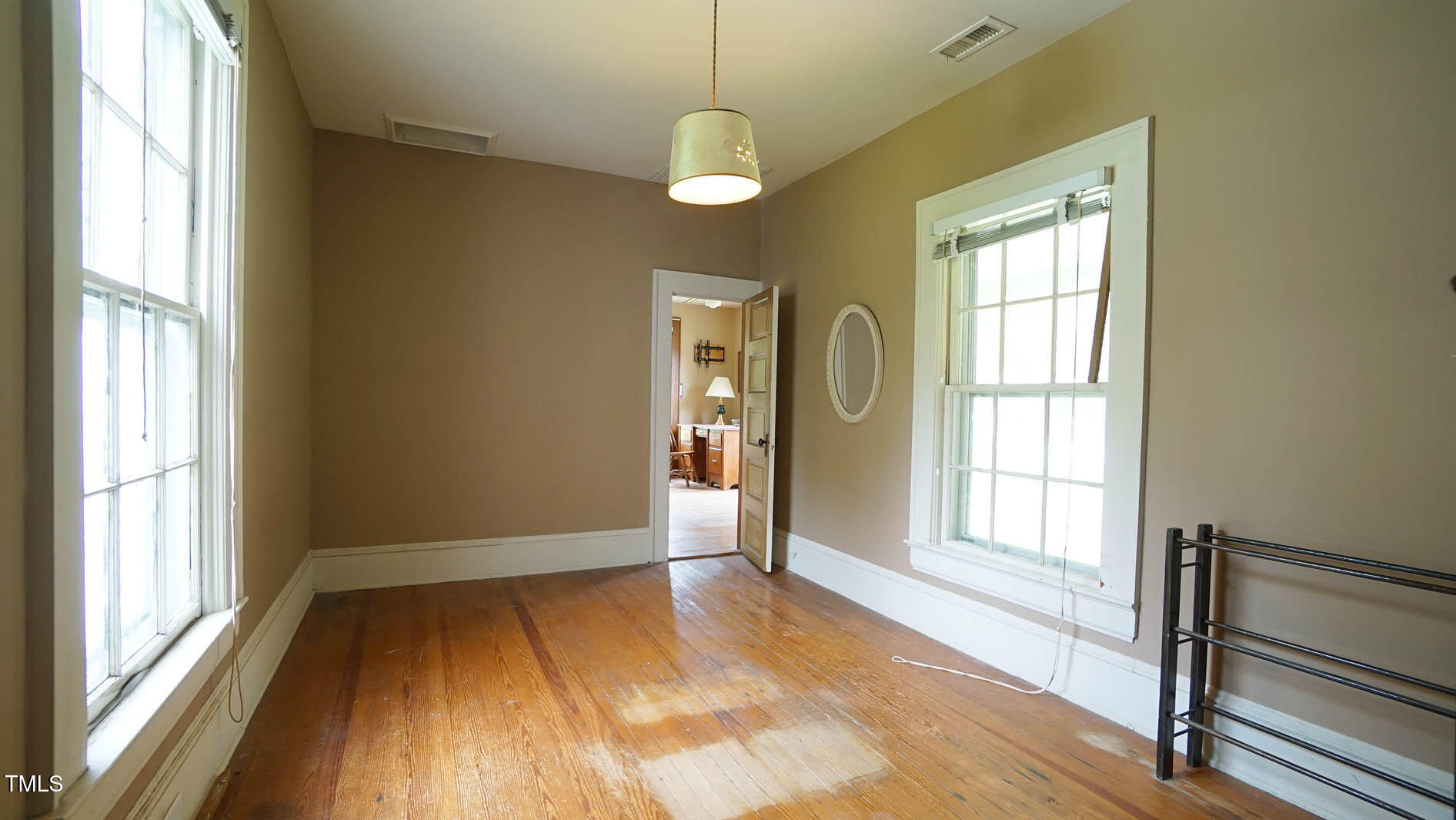 9358 Main Street Castalia, NC 27816 - Photo 61 of 92 a view of an empty room with a window and wooden floor