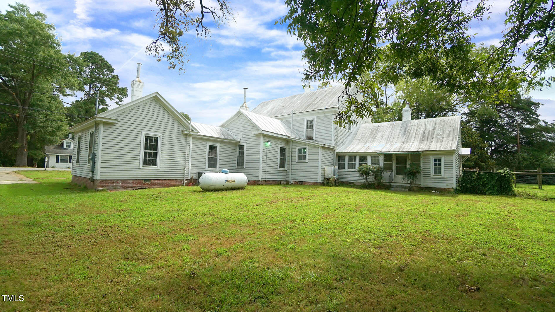 9358 Main Street Castalia, NC 27816 - Photo 84 of 92 a front view of a house with a garden and porch
