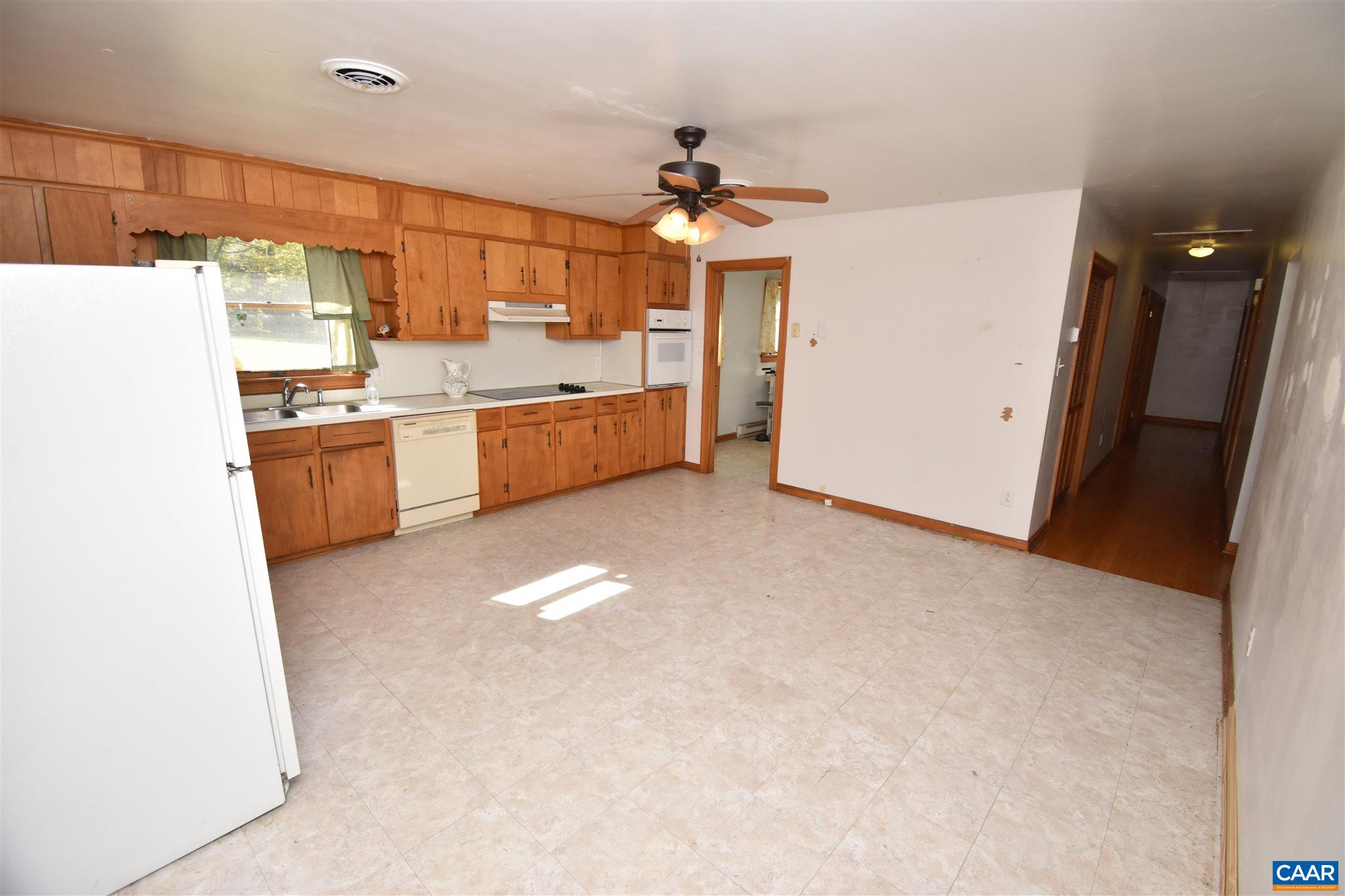 26 Warmar Road Ruckersville, VA 22968 - Photo 11 of 30 a large kitchen with a sink stainless steel appliances and cabinets